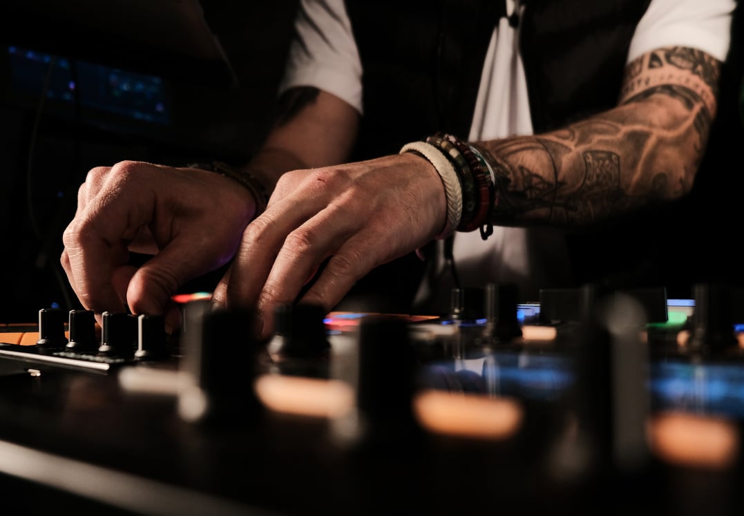 Closeup of a person playing songs and DJing - good for party-related categories